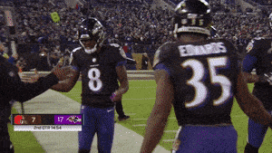Download NFL Quarterback Lamar Jackson with the Baltimore Ravens Wallpaper